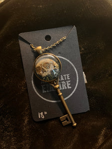 Death Garden print in brass key pendant