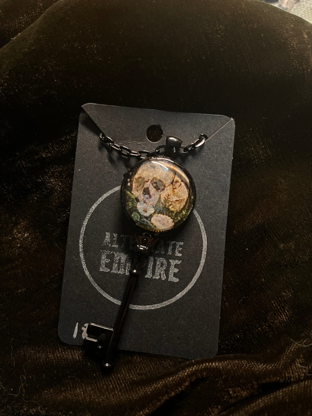 Skull and flower key pendant