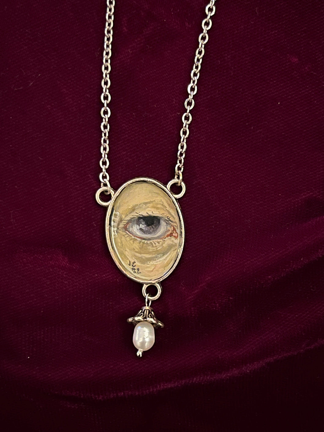 Mysterious Eye with Pearl Necklace